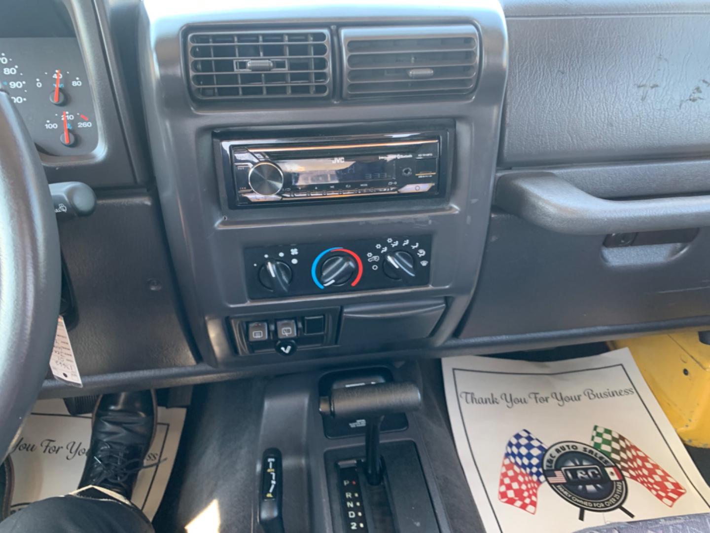 2001 Yellow /Black Jeep Wrangler WRANGLER (1J4FA49S81P) with an 6 Cylinders S 4.0L FI OHV 242 CID engine, AUTOMATIC transmission, located at 1830 North Belt Line Road, Irving, TX, 75061, (469) 524-0199, 32.834373, -96.993584 - Photo#11